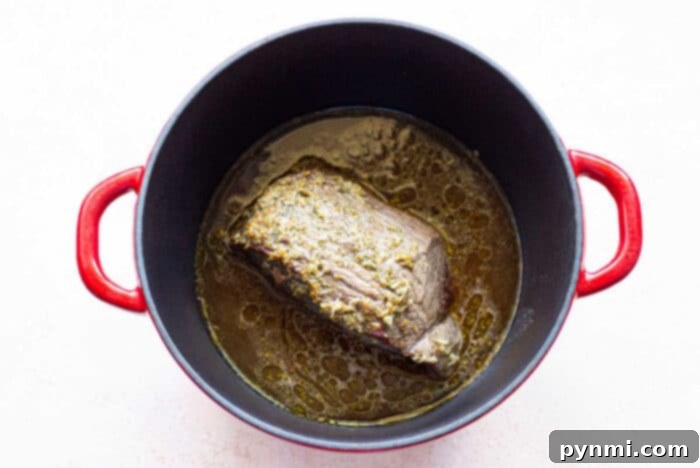 A hearty Dutch Oven Roast and Vegetables meal, ready to serve.