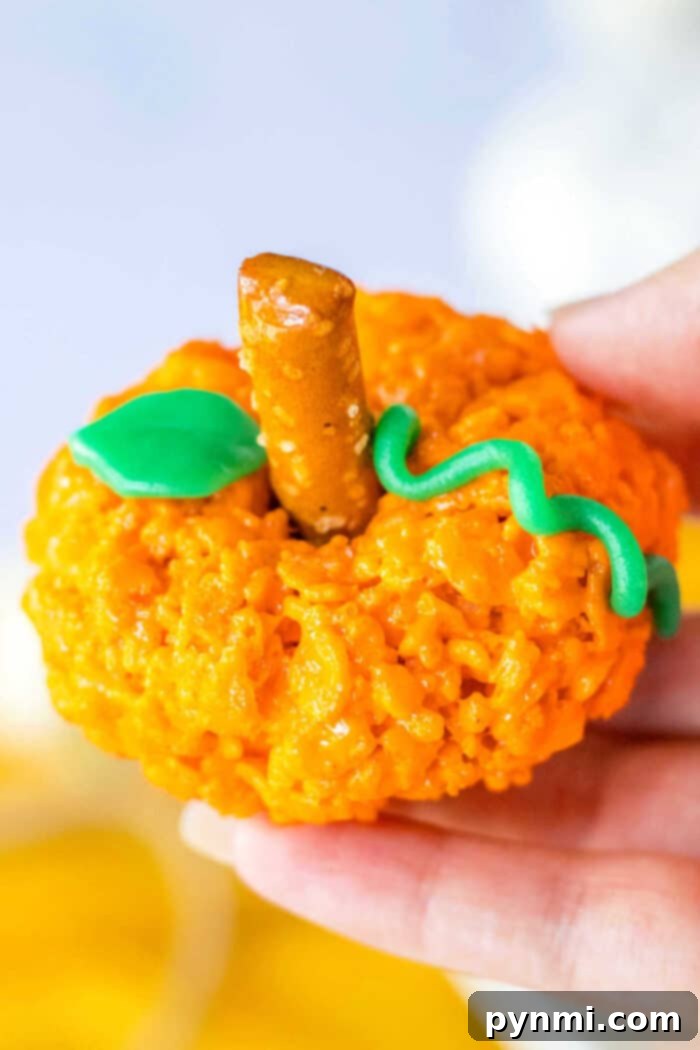 Halloween Rice Krispie Treats arranged on a platter, ready for festive gatherings.