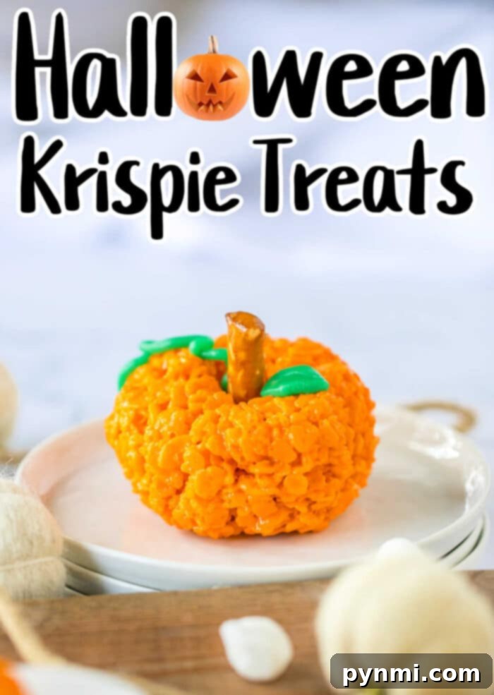 Rice Krispie Treat for Halloween with vibrant orange color and decorative elements.
