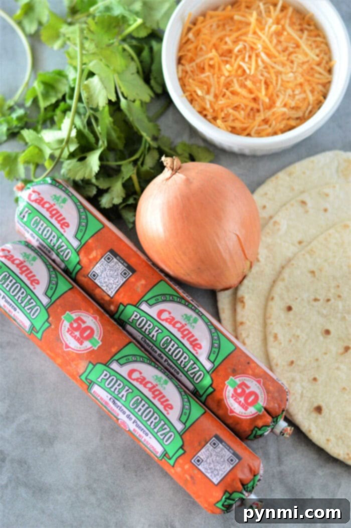 Two plates with delicious Chorizo Tacos, garnished with fresh herbs.