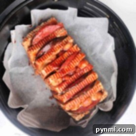 A loaf of halloumi cheese sliced and cooked in the air fryer