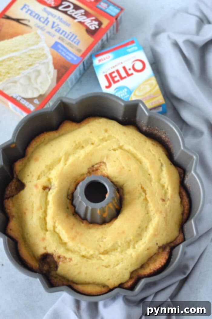 Bakery Style Snickerdoodle Bundt Made Easy 5 A Snickerdoodle Nothing Bundt Cake copycat, beautifully glazed and ready to serve on a rustic wooden surface.