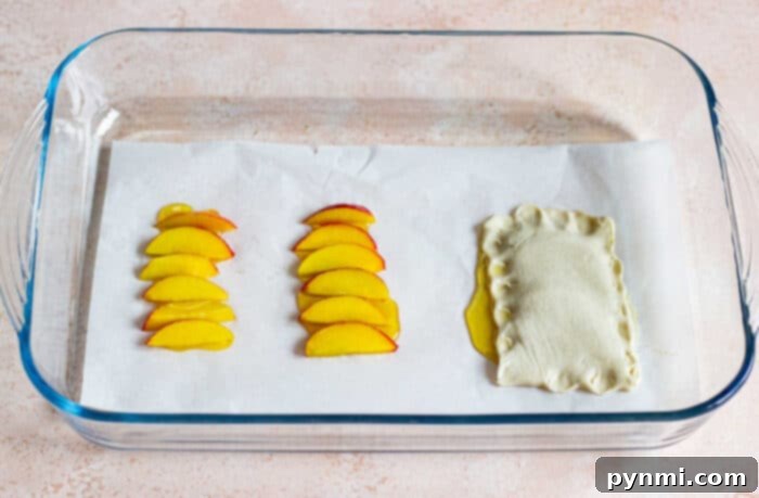 Golden Peach Delight 3 Close-up of a rustic peach tart with flaky puff pastry, drizzled with honey, and adorned with fresh thyme sprigs.