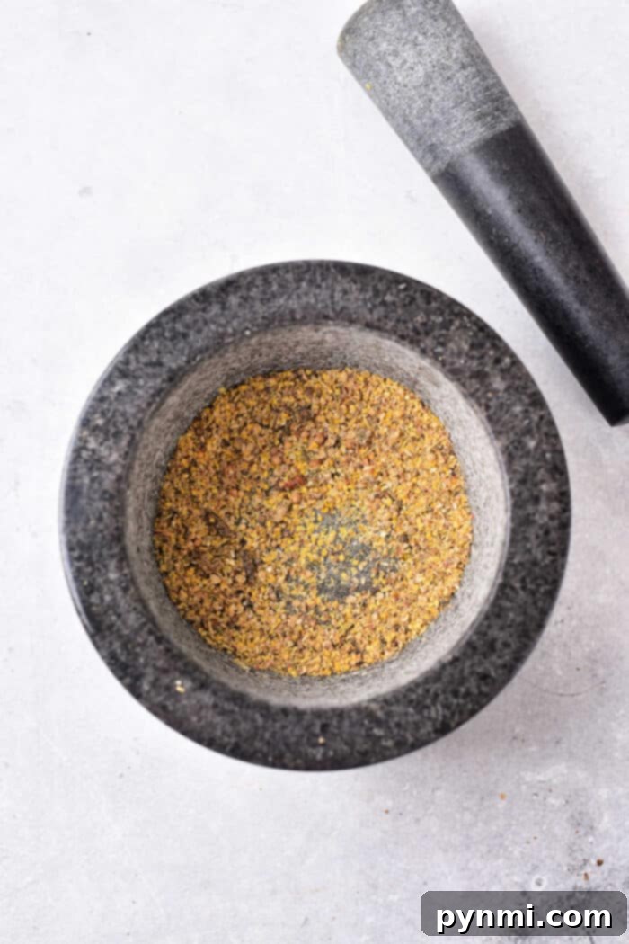 Toasted whole spices for corned beef seasoning, cooled and ready for grinding.