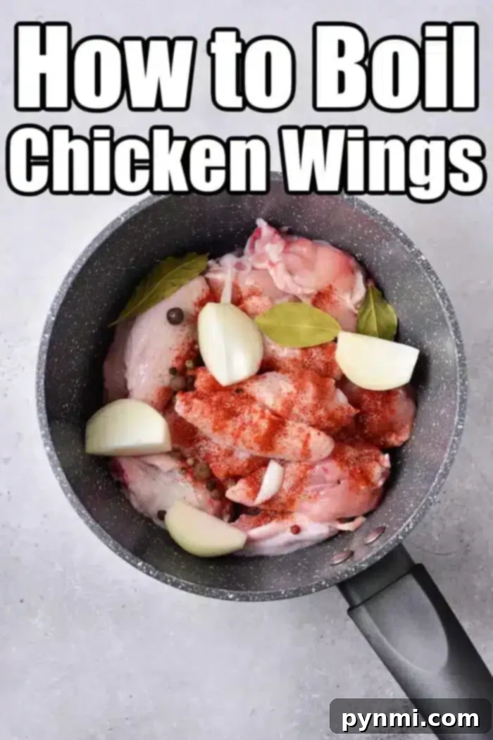 Poached Chicken Wings 3 A large pot filled with boiling chicken wings, seasoned with onion slices, bay leaves, and various spices, reflecting the "How to Boil Chicken Wings" theme.