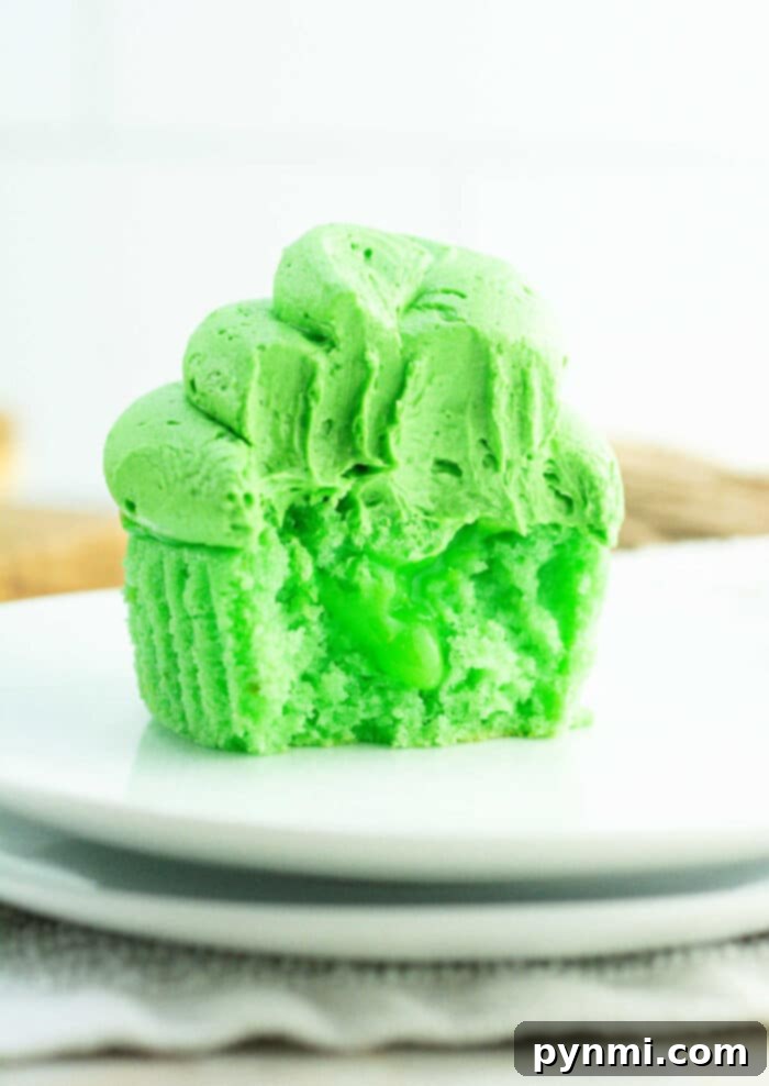 Velvet Curd Cupcakes 2 Vibrant green lime curd cupcakes with smooth frosting, ready to be enjoyed.