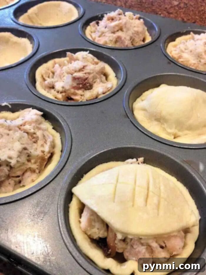 Puff pastry mini tarts baked in a muffin tin, filled with fruit or cheese.