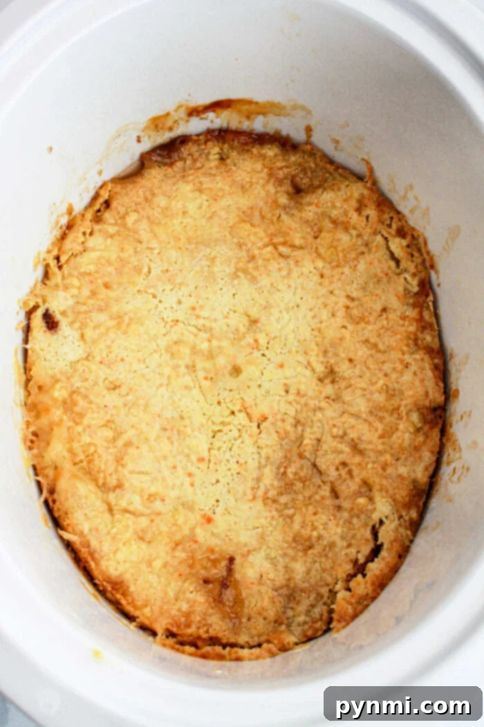 slow cooker peach cake, garnished and ready to eat