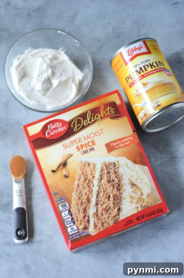 Effortless Pumpkin Spice Cake Mix Bars 3 A vibrant close-up of beautifully frosted Cake Mix Pumpkin Bars, ready to be enjoyed.