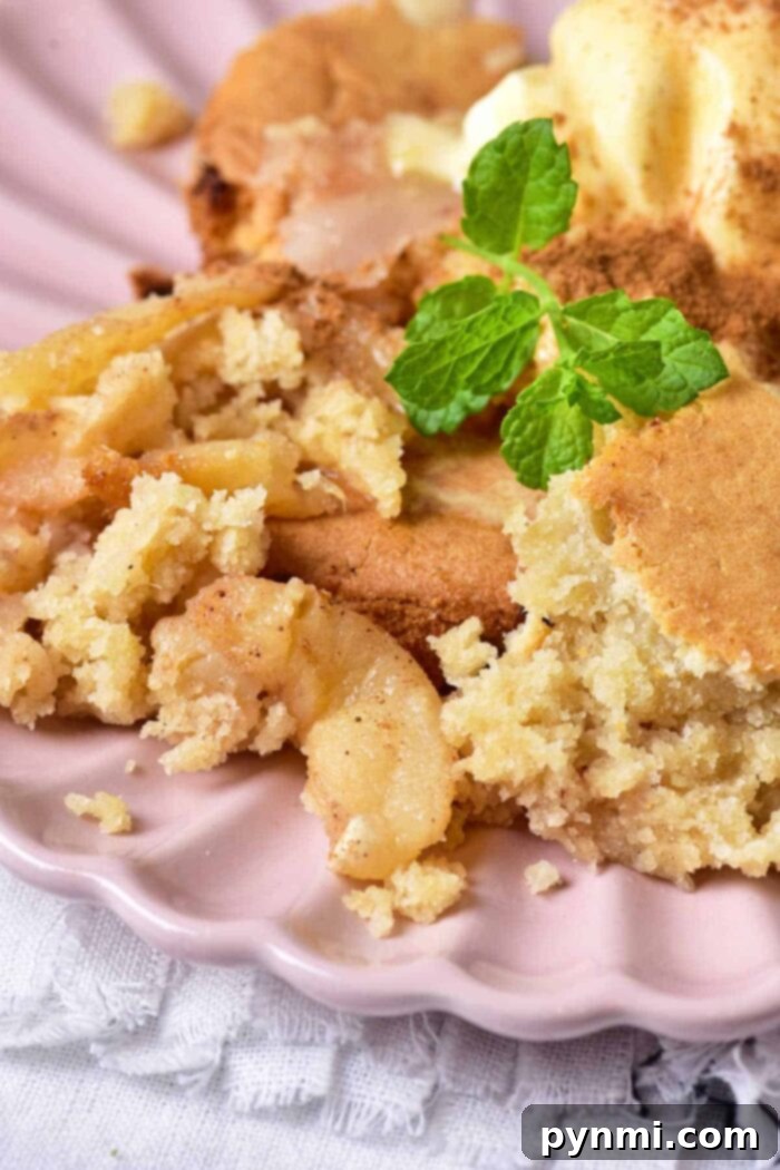 Beautifully caramelized pear upside down cake, fresh from the oven, showcasing perfectly arranged pear slices on top of a golden-brown cake. Ideal for a cozy dessert.