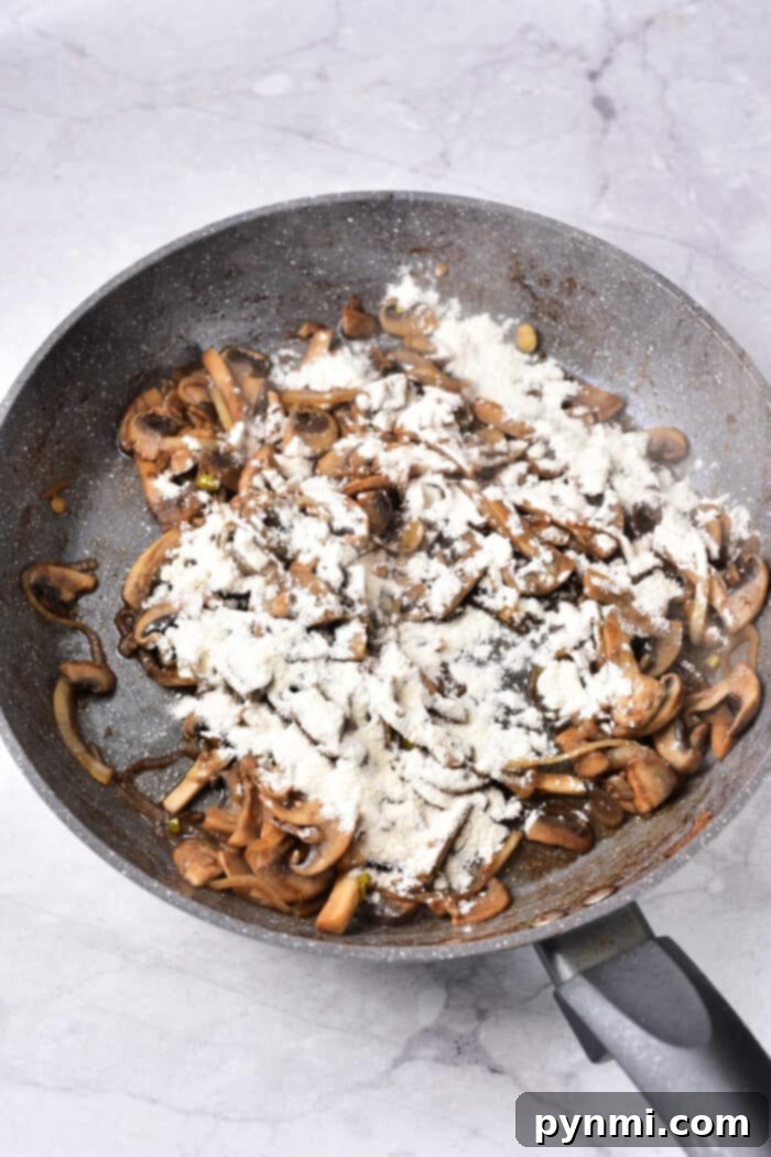 Velvety Dairy-Free Beef Stroganoff 4 A serving of Dairy Free Ground Beef Stroganoff with noodles, garnished with herbs.