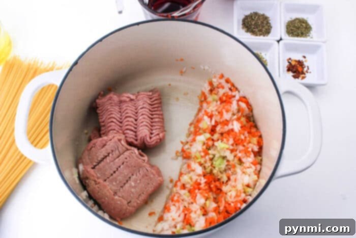 A bowl of delicious ground turkey bolognese sauce, garnished and ready to eat.