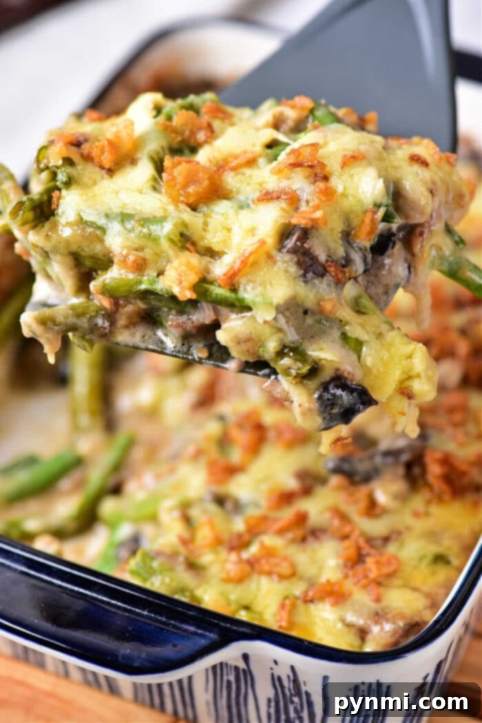 Cheesy Green Bean Casserole served in a blue dish, ready to be enjoyed.