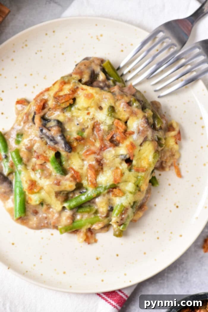 Green Bean Casserole with Cheese in a rustic serving dish.