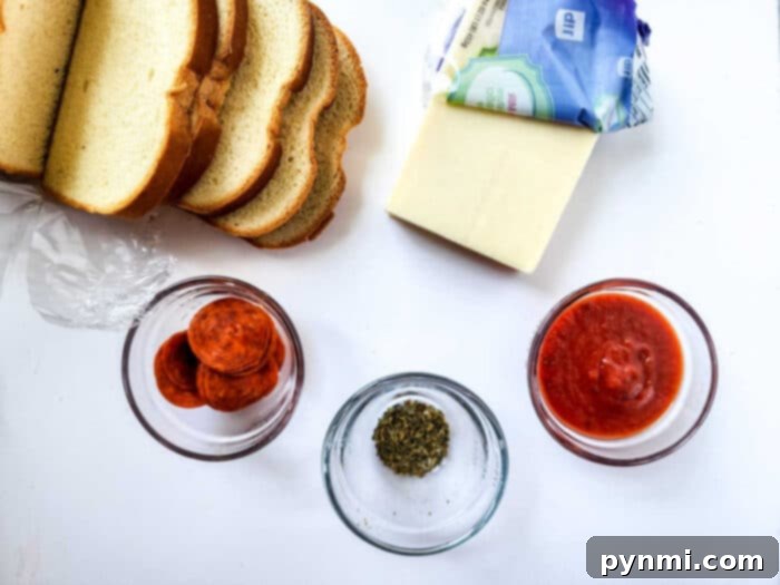 Air fryer pizza toast with golden crust and melted cheese, garnished with herbs.