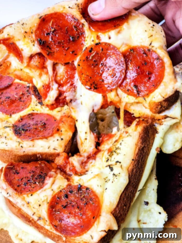 Grilled cheese pizza toast made with Texas toast, topped with pepperoni and melted cheese.