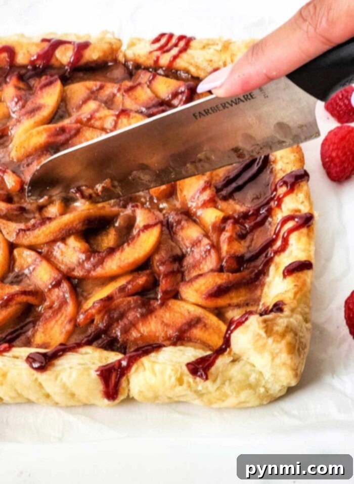 Finished Puff Pastry Tart, garnished with fresh fruit and a drizzle, ready to serve.