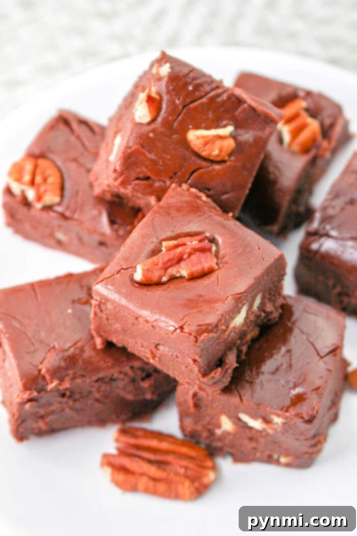 Surprisingly Velvety Fudge 7 Stacked pieces of rich, dark cheese fudge, ready to be enjoyed.