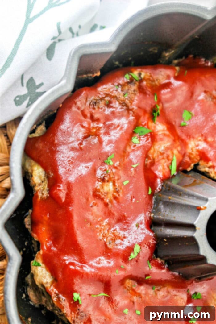 Showstopping Bundt Meatloaf 5 A whole meatloaf shaped from a bundt pan, ready to be sliced