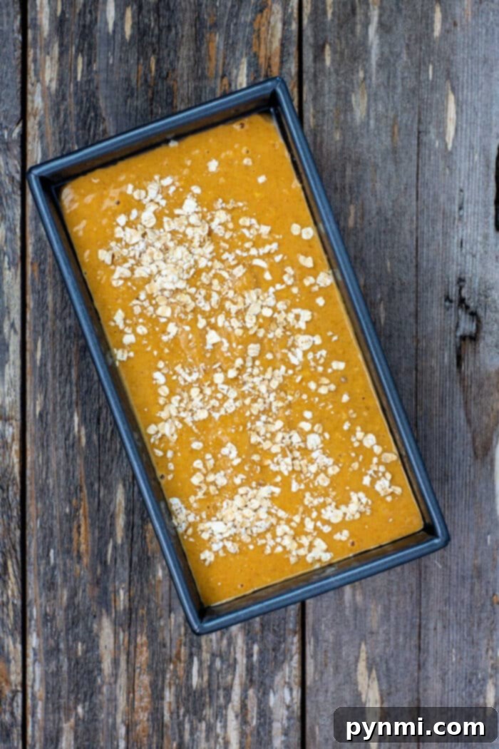 Spiced Maple Pumpkin Loaf 5 Sliced maple pumpkin bread with oats, beautifully presented.