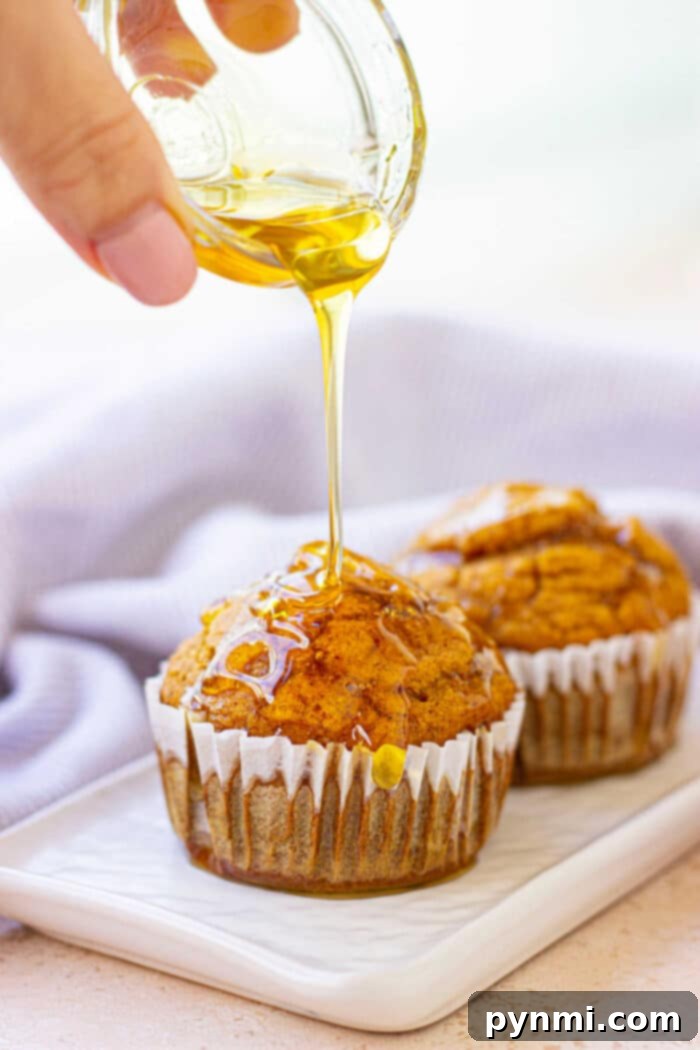 Perfect Gluten-Free Pumpkin Muffins 6 Gluten Free Pumpkin Muffins on a wire rack