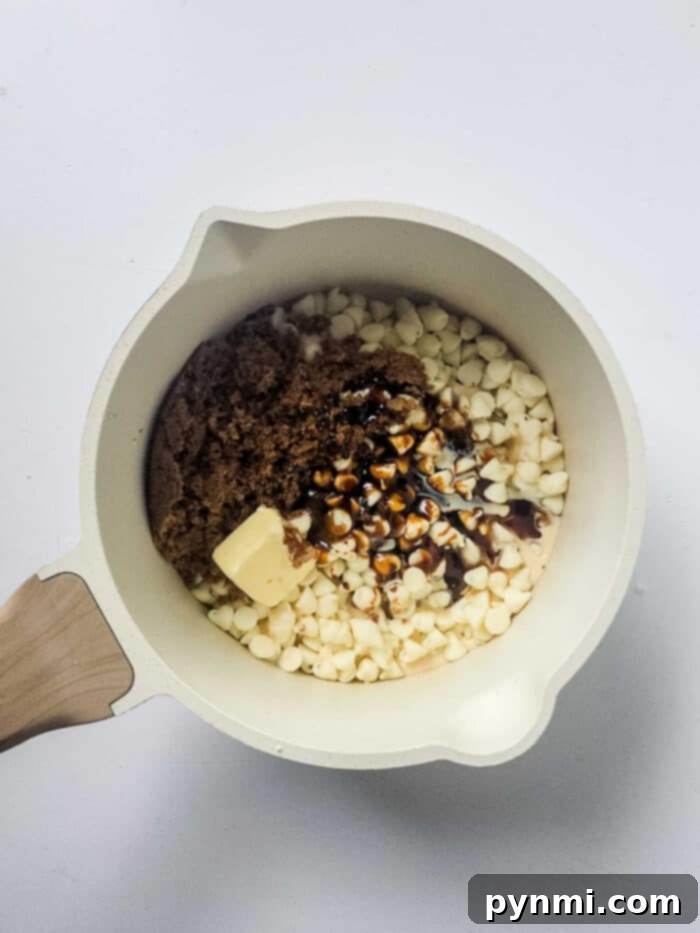 Fudge mixture being stirred in a saucepan on the stovetop