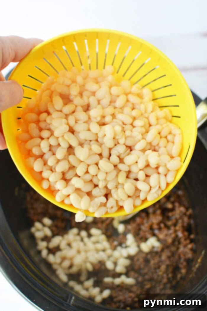Hearty Cowboy Beef and Bean Casserole 5 Hearty Baked Beans with Ground Beef made from dry beans, simmering to perfection.