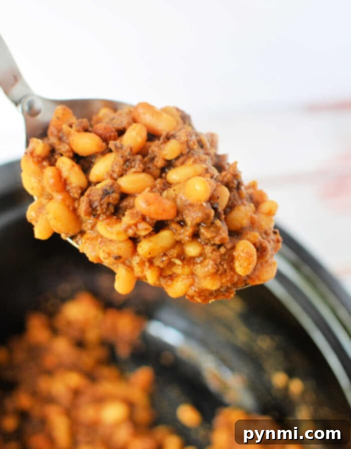Hearty Cowboy Beef and Bean Casserole 7 A serving of Baked Beans with Ground Beef, ready to be enjoyed.