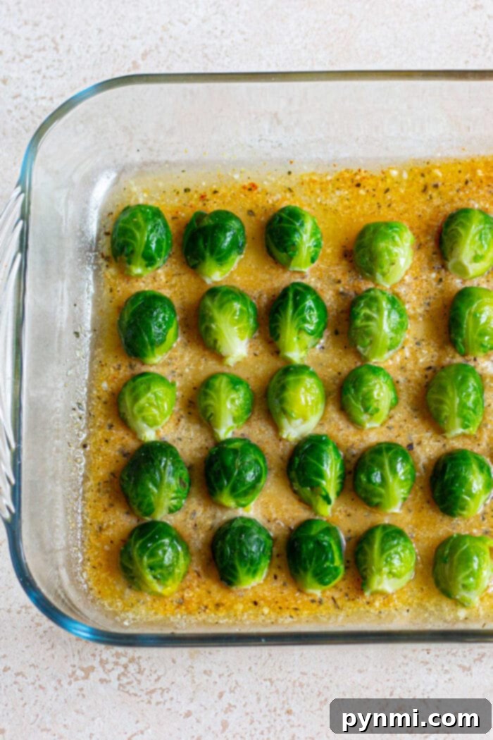 Fresh Brussel Sprouts prepared for roasting, with some halved and ready for the Parmesan crust.