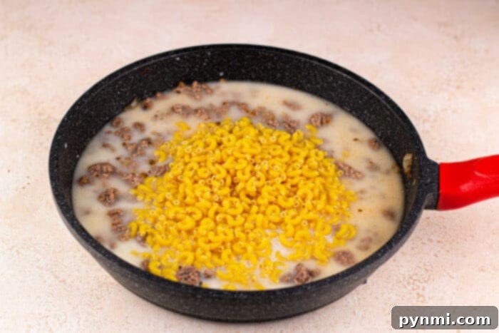 Ultimate Cheesy Beef Mac 4 Close-up of a skillet filled with rich and creamy Mac and Cheese with Hamburger
