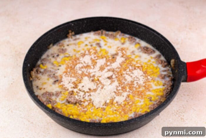 Ultimate Cheesy Beef Mac 5 Skillet hamburger macaroni cooking on the stovetop
