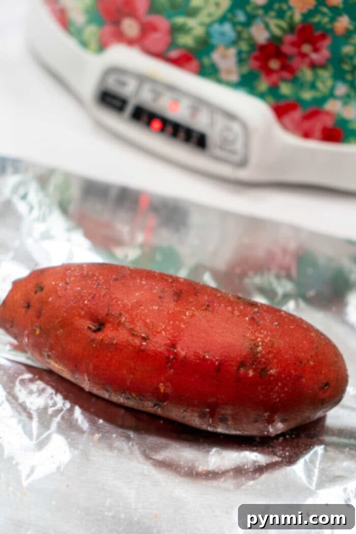 Set It and Forget It Whole Sweet Potatoes 4 Crockpot Yams cooking in foil