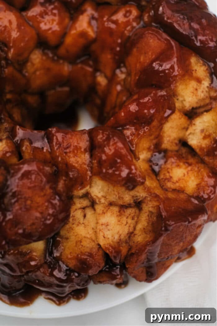 Quick & Gooey Pillsbury Cinnamon Rolls 7 monkey bread with grands cinnamon rolls - A close-up of a portion of monkey bread being pulled apart