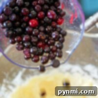 Beyond Potatoes What Defines Idaho 6 Pouring a mix of huckleberries into a bowl with batter, this easy muffin recipe promises delicious results.
