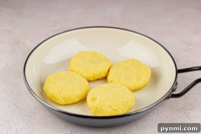 Kettle Cornbread Comfort 4 Hot Water Cornbread Recipe ingredients laid out: cornmeal, salt, sugar, and a bowl of boiling water.