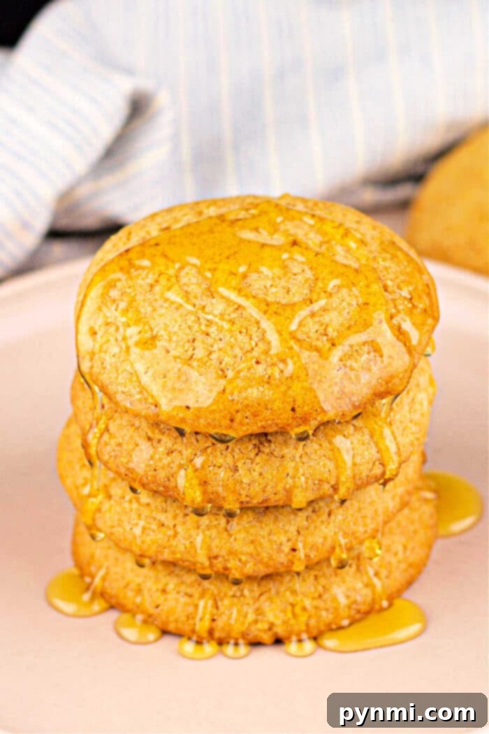 Cornbread Cookies: A close-up of a stack of cookies with a honey drizzle