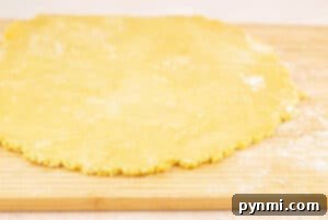 Buttery Shortbread Pie Crust 8 Round sheet of shortbread pie crust dough on a floured wooden surface