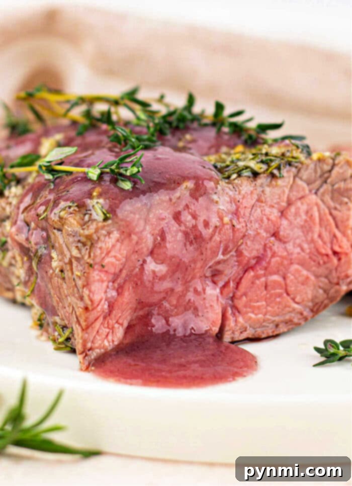 Beef Bottom Round Roast, perfectly cooked and sliced, ready to be served.