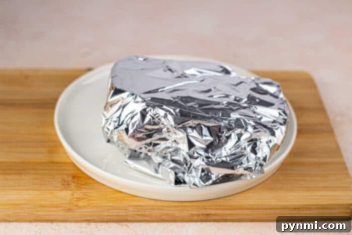 Close-up of tender, perfectly cooked roast beef slices, showcasing how to make beef roast tender.