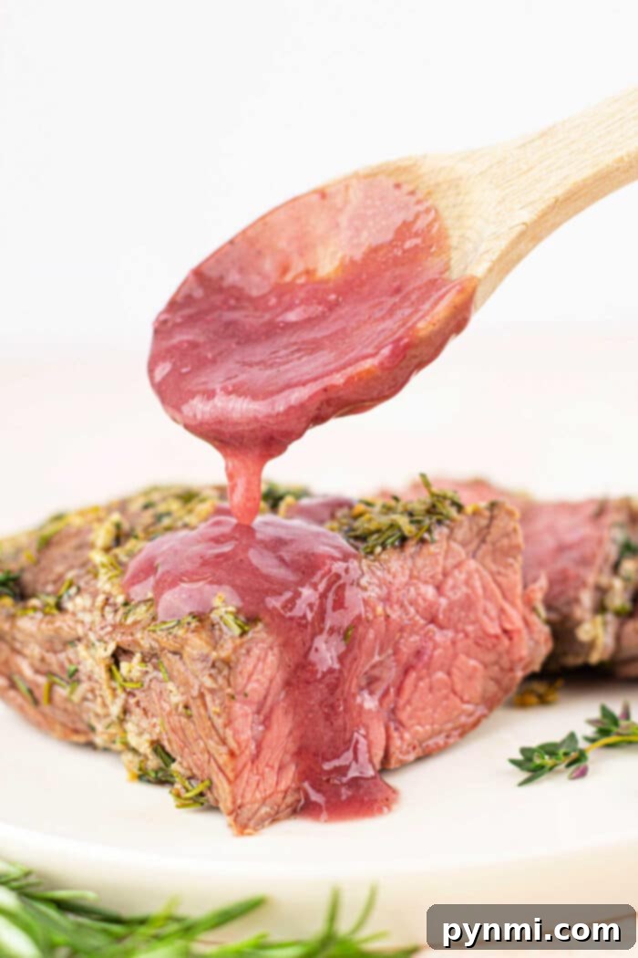 A whole cooked Bottom Round Roast Beef, beautifully browned and ready for carving.