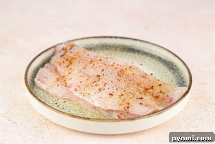 Close-up of raw Swai fish fillets, ready for cooking.