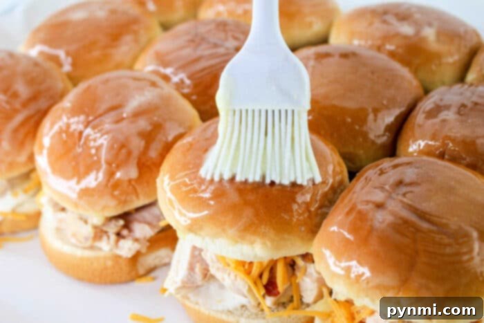 Buffalo Chicken Sliders - A vibrant arrangement of buffalo chicken sliders, indicating a spicy alternative to the classic ranch flavor.