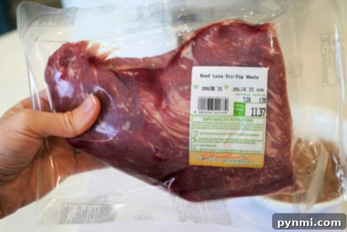 what to make with tri tip leftovers - Thinly sliced tri-tip on a cutting board