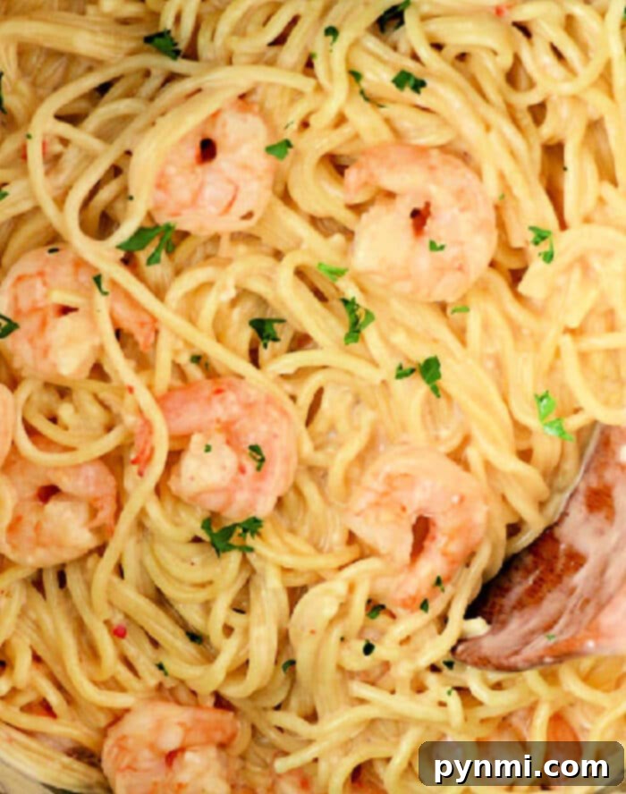 Next-Day Shrimp Sensations 4 Close-up of a delicious leftover shrimp pasta dish, showcasing easy and quick meal ideas with cooked shrimp.