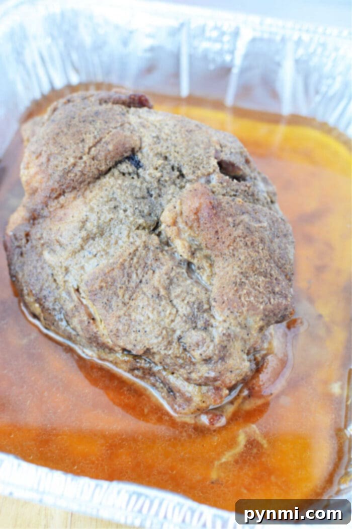 Slow Roasted Boston Butt Perfection 6 Juicy Boston Butt shredded and sauced, perfect for sandwiches, baked at 250 degrees Fahrenheit.