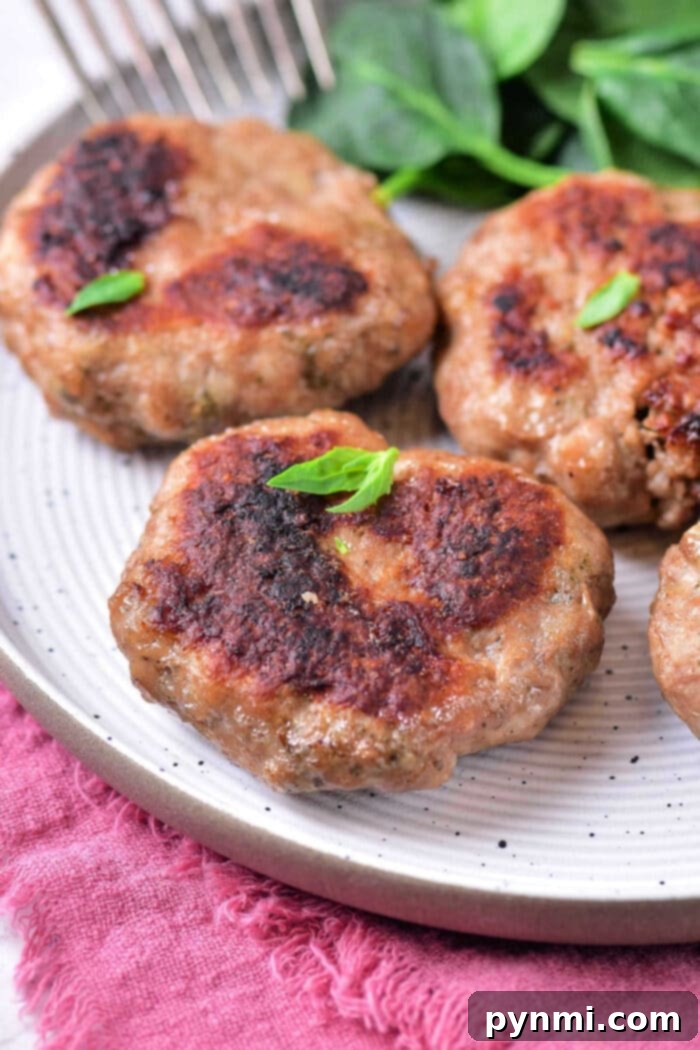Sausage Patties in Oven: Golden-brown, perfectly cooked sausage patties on a baking sheet, ready for breakfast.