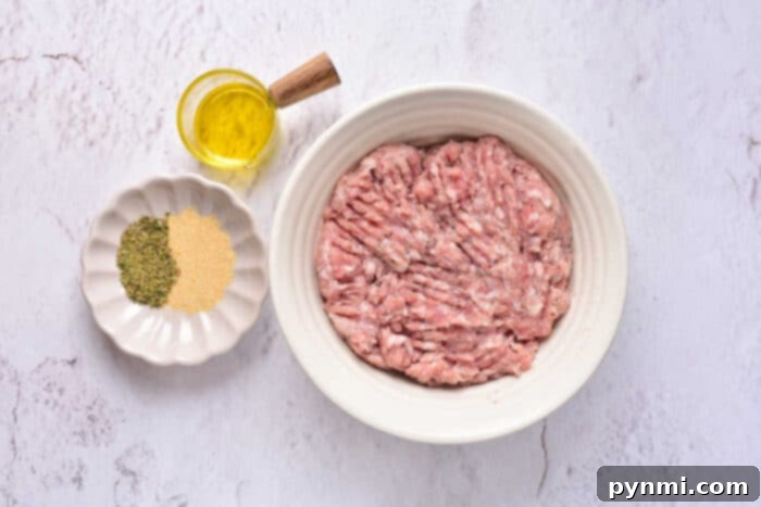 Breakfast Sausage in Oven: A close-up of sizzling breakfast sausage patties on a baking sheet, showcasing their crispy edges.