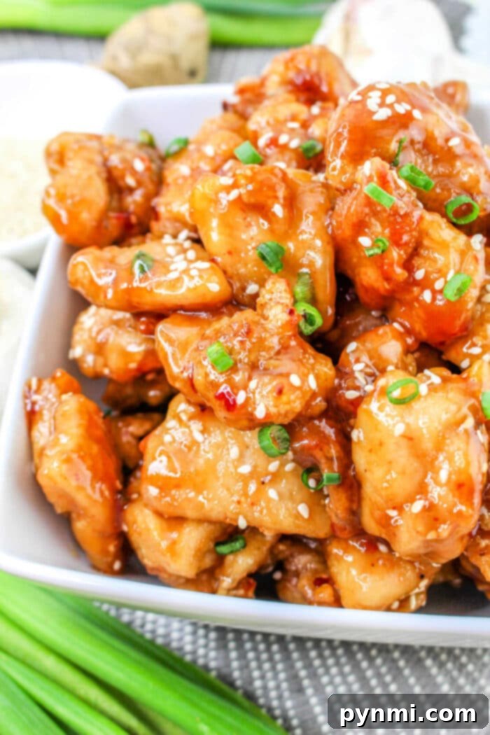 Sticky Honey Garlic Chicken 2 Crispy Honey Garlic Chicken Bites in a skillet