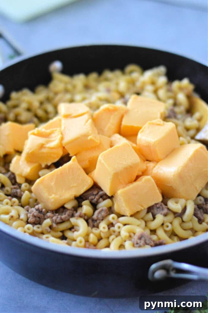 Creamy Velveeta Beef and Pasta Skillet 4 Velveeta Cheeseburger Helper in a pan, ready to serve