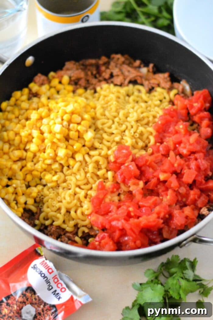 Crunchy Taco Beef Skillet 5 Mexican Hamburger Helper in a skillet, ready to serve.